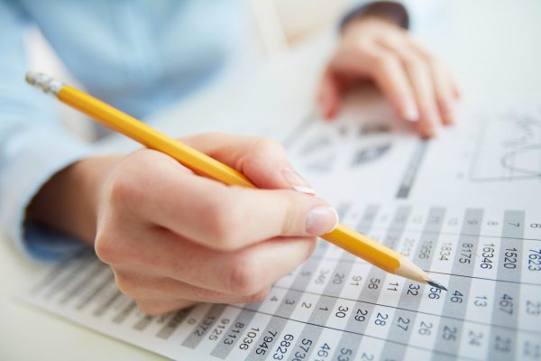 Close-up image of a financial worker analyzing statistical data